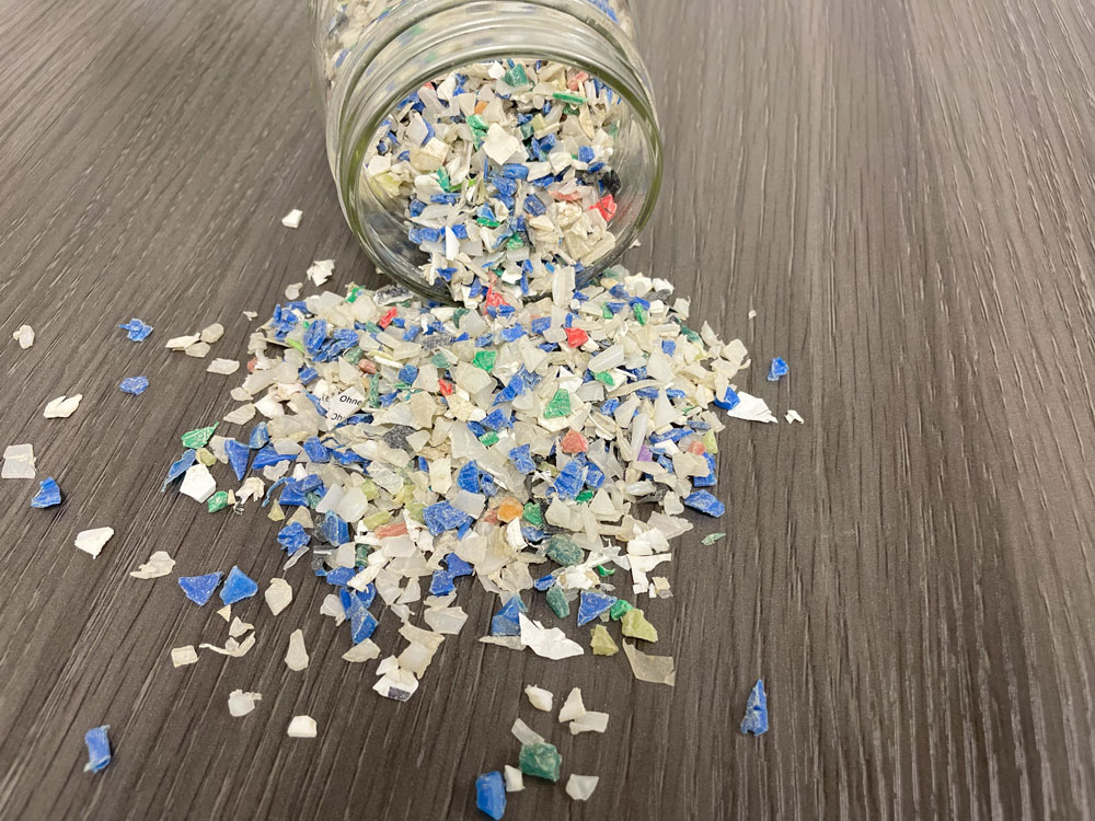 Plastic flakes from recycled hotel amenity bottles Clean the World Global program